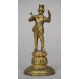 A Victorian brass counter cigar lighter
Formed as Uncle Sam, standing on a stepped spreading