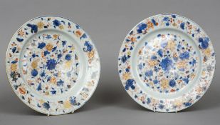 A pair of 18th century Chinese plates
Decorated in the Imari palette, blue painted feather mark to