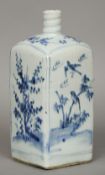 A 17th century Chinese porcelain bottle vase
Decorated in underglaze blue with birds amongst