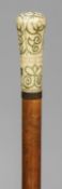 An 18th century pique inlaid ivory handled malacca walking stick
The knop form handle with various