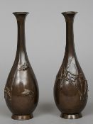 A pair of Japanese bronze vases
With slender hexagonal section necks, the baluster bodies