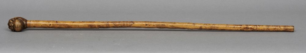 An 18th/19th century carved wood cane
The shaft extensively worked with various figures including