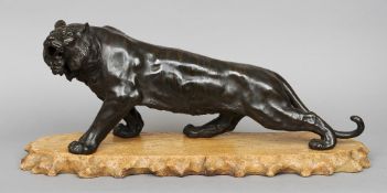 A Japanese Meiji period patinated bronze model of tiger
Naturalistically modelled on all fours,