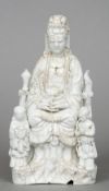 An 18th century Chinese porcelain blanc de chine figural group
Formed as Guanyin seated in the lotus