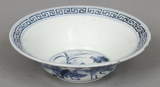 A Chinese porcelain blue and white bowl
Decorated with phoenixes, the interior with a figural