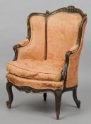 A 19th century French upholstered armchair
The shell and scroll carved top rail above the padded