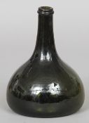 An early 18th century green glass bladder or onion shaped bottle
20.5 cm high. CONDITION REPORTS: