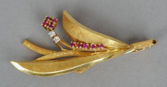 An unmarked gold, diamond and ruby set floral spray brooch
6 cm high. CONDITION REPORTS: