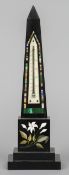 A 19th century pietra dure and specimen marble inlaid black slate desk thermometer
Formed as an