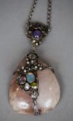 An Arts & Crafts gem set and silver wire worked rose quartz pendant necklace, possibly by Dorrie