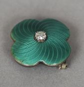 A Russian green enamel and diamond set gold pendant brooch
Of quatrefoil form, centred with a single