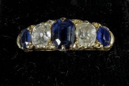 An unmarked gold five stone diamond and sapphire ring
Set with three sapphires and two diamonds