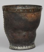 An 18th century leather bucket
Of typical form, undecorated.  26 cm high. CONDITION REPORTS: