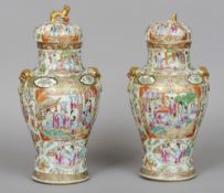 A pair of 19th century Chinese Canton porcelain vases and covers
Each of baluster form,