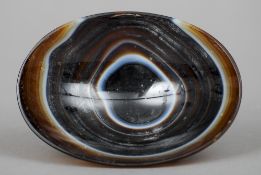 A carved agate shallow bowl
11 cm wide. CONDITION REPORTS: Generally in good condition, expected