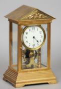 An early 20th century gilt brass four glass battery electric mantel timepiece by Eureka Clock Co