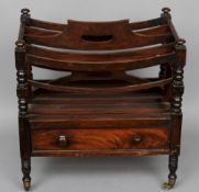 A 19th century mahogany Canterbury
Of rectangular form with bowed dividers and turned and block