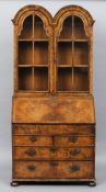 An 18th century and later double dome top burr walnut bureau bookcase
The double domed moulded top