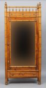 A 19th century pitch pine and faux bamboo single door wardrobe
The galleried top above the single