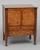 An 18th century Dutch marquetry cabinet
The stepped rectangular top above twin cupboard doors and