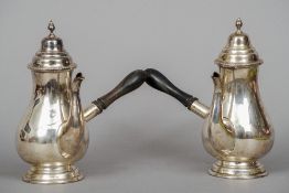 A pair of Edwardian silver chocolate pots, hallmarked Birmingham 1901, maker's mark of Thomas