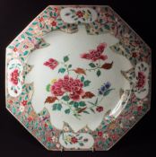 An 18th century Chinese porcelain charger
Of octagonal form, decorated with floral sprays.  43 cm