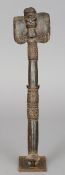 A Yoruba tribal carved hardwood sceptre
The mask headed implement with bands of geometric carving,