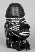 A large carved Solomon Islands Nguzu Nguzu (canoe prow)
Worked as a figurehead holding a bird and