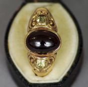 A 19th century garnet and citrine set yellow metal ring
The central stone cabouchon  cut, in