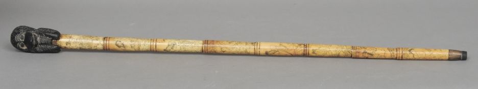 A carved bone sectional walking cane
With monkey carved ebony handle, each section worked with