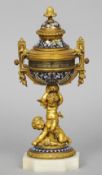 A 19th century cloisonne decorated ormolu ball clock
Formed as a lidded urn with florally cast