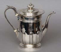 A George IV silver coffee pot, hallmarked London 1820, maker's mark of IET
The front decorated