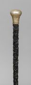 A 19th century silver mounted "Killarney" carved bog oak walking stick
Carved with a harp and