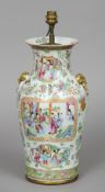 A 19th century Cantonese famille rose vase
Typically decorated with objects amongst floral sprays