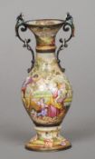 A small 19th century Vienna enamelled vase
The winged bust headed scrolling handles above the main