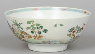 An 18th century Chinese Export punch bowl
The interior with blue enamelled cell diaper border, the