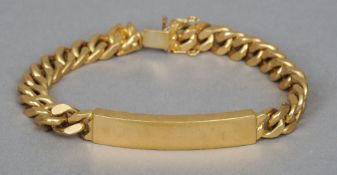 An 18 ct gold identity bracelet
The clasp stamped 750 and 62 AR in a lozenge.  21 cm long overall.