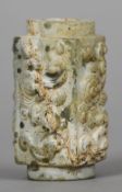A Chinese carved jade kong
Each side carved with a mythical beast.  8 cm long. CONDITION REPORTS: