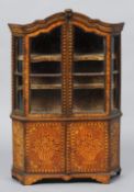 A late 18th/early 19th century Dutch floral marquetry inlaid oak miniature cabinet
The arched