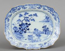 An 18th century Chinese Export blue and white platter
With shaped rim and decorated with quails in a