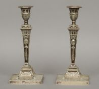 A pair of silver candlesticks, hallmarked London 1900, maker's mark of Thomas Bradbury & Sons
Of