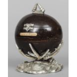 A white metal mounted coconut box 
With shell cast finial, supported on a naturalistic cast base,