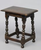 An 18th century and later oak joint stool
With turned legs and moulded apron.  50 cm wide. CONDITION