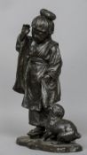 A Japanese Meiji period bronze group
Modelled as a young lady in traditional costume with a puppy