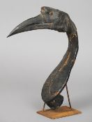 An African tribal sceptre
Modelled as a hornbill with natural beak, the head and neck covered in