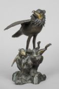 A Japanese bronze censor and cover
Cast as a bird of prey pinning a hare on a naturalistically