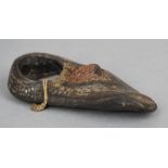 An antique leather sailor's thimble
Of typical form.  9.5 cm long. CONDITION REPORTS: Generally in