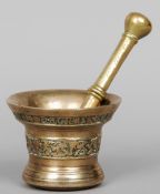 A 16th century European bronze pestle and mortar
The mortar with cast band of decoration and text