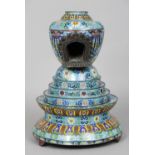 A 19th century Chinese cloisonne shrine
The upper section incorporating an inset recess, the base