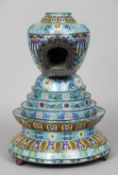 A 19th century Chinese cloisonne shrine
The upper section incorporating an inset recess, the base